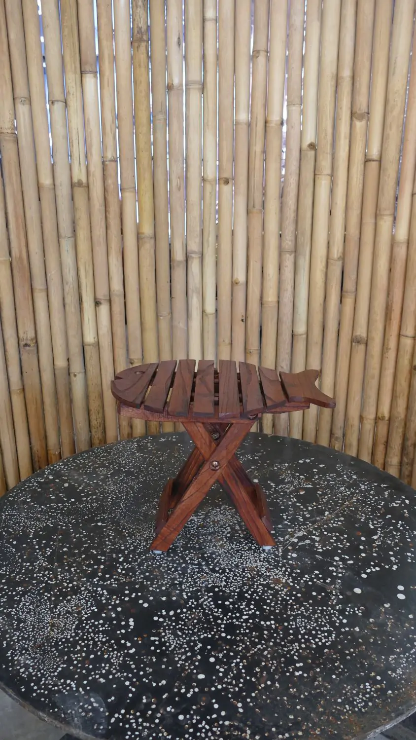  Product image 1 of the product “Folding table in shape of fish, made of wood. 33cm Height. Dark Brown lacquered. ”